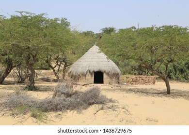 Tharparkar Sindh, Pakistan - March, 2019:  Village Huts In Thar Desert Old Poor Houses Animals In Rajhastan India, Hinduism In Pakistan Hindu Religion People