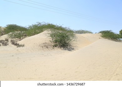 Tharparkar Sindh, Pakistan - March, 2019:  Village Huts In Thar Desert Old Poor Houses Animals In Rajhastan India, Hinduism In Pakistan Hindu Religion People