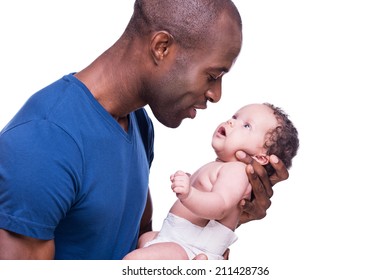 That Is My Boy! Side View Of Happy Young African Man Holding His Little Baby And Looking At Him While Standing Isolated On White