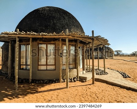 Thatched round safari lodge in a remote location in Namibia, Africa