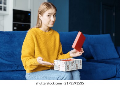 Thats Not What I Want. Portrait Of Dissatisfied Sad Woman With Opened Gift Box Looking At Camera. Upset Female Disappointed With The Bad Birthday Or Terrible, Horrible, Awful Anniversary Present