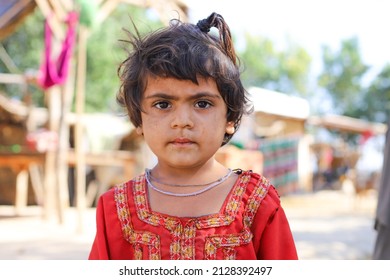 Thatta, Sindh, Pakistan - March 18, 2020: Poor Face Of A Little Girl Pakistani Village