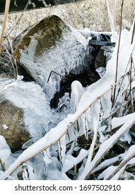 Thaw Spring Frosty Miracle In The Form Of Ice Floes Frozen Water Under The Pipe Its Cold World And Frozen Earth