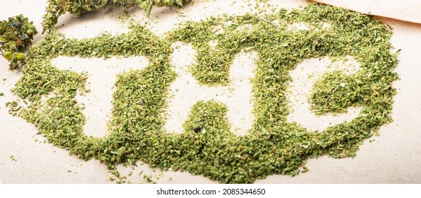 THC Lettering On Green Shredded Marijuana Buds Medical Cannabis.