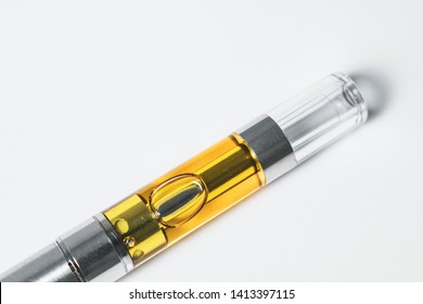 THC/CBD Cannabinoid Concentrate A Liquid Distillate Cannabis Oil In An Electronic Vape (cartridge) Up-close Isolated On White Background