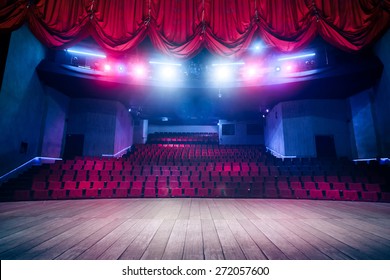Theater curtain and stage with dramatic lighting - Shutterstock ID 272057600