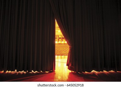 Theater seats through curtains.. behind scene - Shutterstock ID 645052918