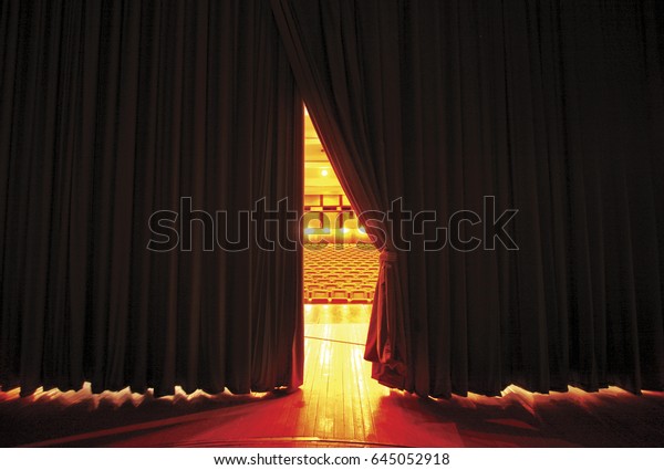 Theater seats\
through curtains.. behind\
scene