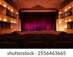 Theatre interior with stage and rows of comfortable seats