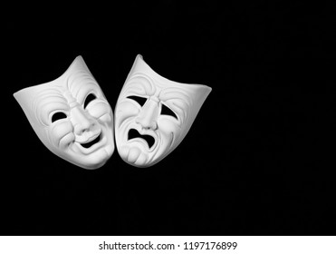 Theatre Mask Expresing The Tragedy And The Comedy, White Mask On Black Background With Free Space For Text