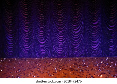 Theatrical Background. Purple Stage Curtains And Floor.