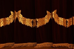 Theatrical Dark Red Velvet Curtain With Golden Fringe. Texture Background For Design.