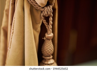 theatrical golden curtain. close-up of golden curtain - photographed, not illustrated. Golden curtain background. Background depicting theater curtain close-up photo 