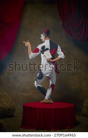 Theatrical jester turning back while holding hidden Joker card. Concept of gambling narratives, mystery elements, casino storytelling, and themed character art for campaign visuals.