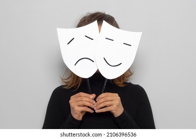 Theatrical mask in the form of a smiling and sad face.