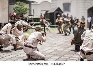theatrical war general attack 1 march, using war uniforms and weapons in the Dutch colonial era. They shoot each other. : Yogyakarta, Indonesia - 01 March 2022