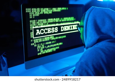 Theft, man or hacker with computer or screen for cybercrime, malware or phishing for stealing online data. Programmer, night or software update on pc with hacking expert or access denied notification - Powered by Shutterstock - Get 15% off with code: PIKWIZARD15