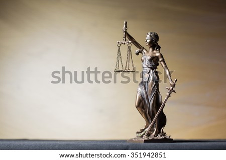 Themis figure on brown background