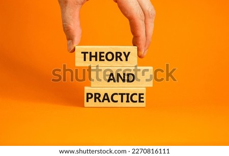 Theory and practice symbol. Wooden blocks with words 'Theory and practice' on a beautiful orange background. Businessman hand. Business, theory and practice concept. Copy space.