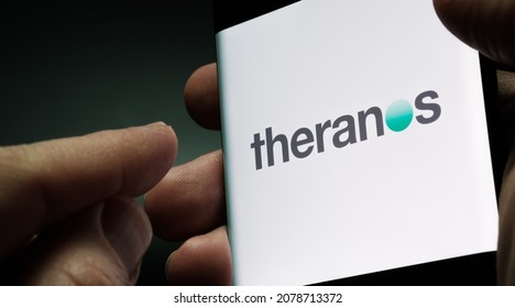 Theranos company logo seen on smartphone screen hold in hand. Stafford, United Kingdom, November 21, 2021.