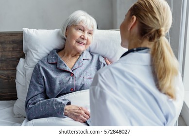 Therapeutic Taking Care Of Her Client In Hospital Room