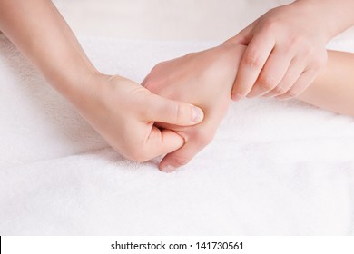 Therapist Doing A Pressure Point Massage On The Woman's Right Hand