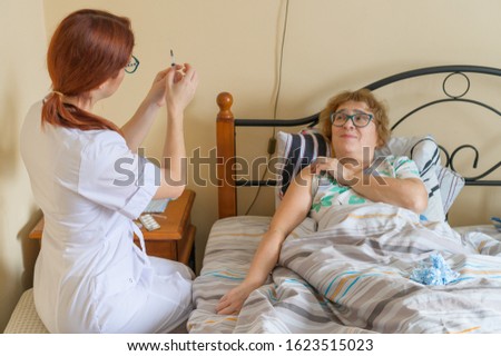 Similar – Caregiver helping elderly patient to stand up