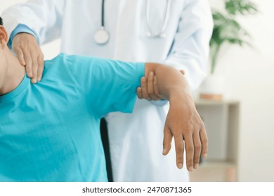 The therapist Stretched a Patient about pain in the muscles of the arms and Shoulders. office syndrome problem physical therapy diagnostic. making neck massages.Rehabilitation physiotherapy concept.  - Powered by Shutterstock