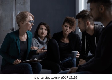 Therapist Talking With Patients Of Rehab Centre