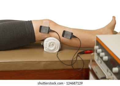 therapist treatment patient  with electrical stimulator for increase muscle strength and release pain