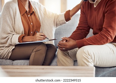 Therapy, Counseling And Grief With A Black Man Patient And Woman Counselor Talking In Session. Writing, Hands And Female Mental Health Therapist Helping A Male Client With Depression Or Anxiety