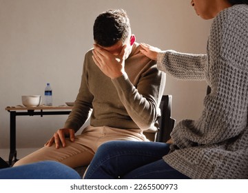 Therapy, support and crying man with empathy, psychology help and mental health problem, depression and counseling. Therapist group, community and sad, depressed or rehabilitation for person stress