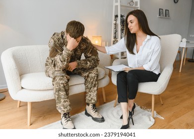 Therapy, support and military man with psychologist talking about ptsd, mental health and stress from war. Psychology, above and veteran in communication with a therapist for consultation on trauma - Powered by Shutterstock