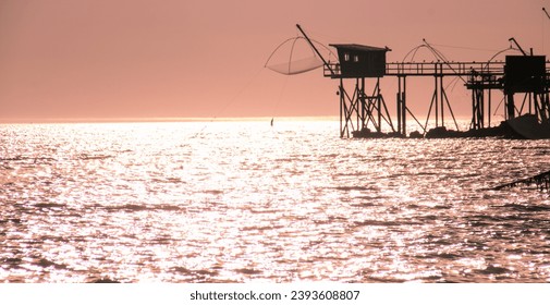 There are 36 fisheries in the Pays de Retz along the coast between the beaches of Lancastria and the port of Collet. These "fishermen's huts" are in Loire Atlantique in France - Powered by Shutterstock