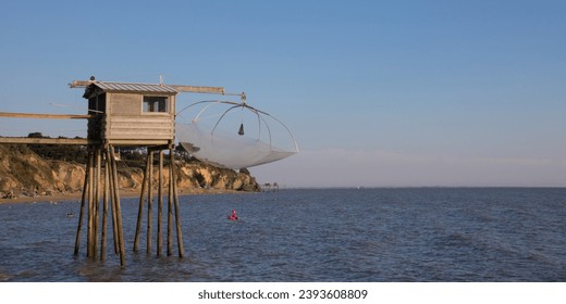 There are 36 fisheries in the Pays de Retz along the coast between the beaches of Lancastria and the port of Collet. These "fishermen's huts" are in Loire Atlantique in France - Powered by Shutterstock