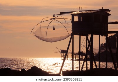 There are 36 fisheries in the Pays de Retz along the coast between the beaches of Lancastria and the port of Collet. These "fishermen's huts" are in Loire Atlantique in France - Powered by Shutterstock