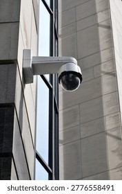 There is a CCTV camera installed on the building. City safety.
