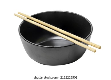 There Is The Clean Black Ceramic Bowl With The Wooden Chopsticks On The White Background. The Food Photography Of Empty Plate With Sticks. This Is The Isolated Image.