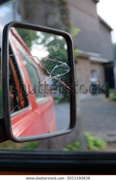 there is a\
crack in the rear view mirror of the\
car