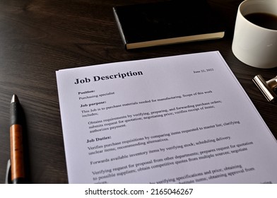 There is dummy documents that created for the photo shoot on the desk about Job Description. - Shutterstock ID 2165046267