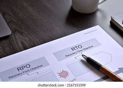 There is dummy documents that created for the photo shoot on the desk about RPO＆RTO.