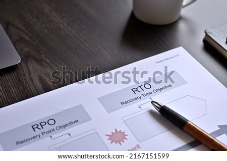 There is dummy documents that created for the photo shoot on the desk about RPO＆RTO.