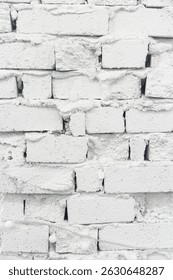 There are gaps between the irregularly stacked brick walls, the walls are painted white, and white miniature light bulbs are hung on the walls.