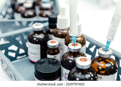 There are jars with phytin peeling, amino acid cocktail, mesocotail and vitamin complex in a plastic box in the kaosmetologist office- Minsk, Belarus- August 20, 2021. Horizontal photo