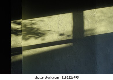 There Are Lattice Shapes And Shadows Of Light On The Walls.