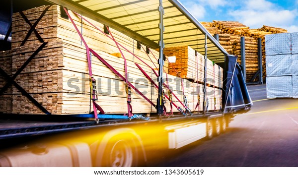 There is a\
loading to the truck trailer . fastening of freight in the trailer\
. Truck in unloading in warehouse\
.