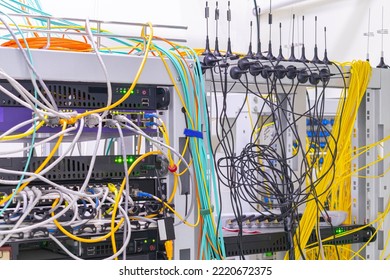 There Are Many Communication Cables In The Server Room Of The Data Center. Small Antennas Of Gsm Gateways Are Installed In The Server Rack.