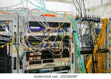 There Are Many Communication Cables In The Server Room Of The Data Center. Small Antennas Of Gsm Gateways Are Installed In The Server Rack.