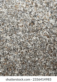 There are many materials used to make the floor, including cement, rock, concrete, lime, and water. They are all mixed together and homogenized. Then it became a floor with a nice design. - Shutterstock ID 2336414983