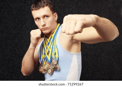 There Are Many Medals On The Neck The Athlete Has